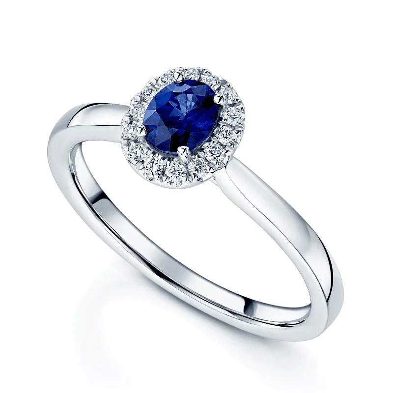 Men's Diamond Engagement Rings with Platinum Band and Halo Setting for a Luxury ProposalPlatinum Oval Sapphire And Diamond Halo Ring Men's Diamond Engagement Rings with Platinum Band and Halo Setting for a Luxury ProposalPlatinum Oval Sapphire And Diamond Halo Ring