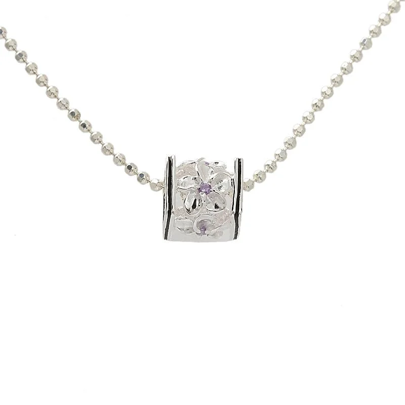 Adjustable length necklaces for versatilitySterling Silver Plumeria with Purple CZ Black Border Cube Pendant (S/M) (Chain Sold Separately) Adjustable length necklaces for versatilitySterling Silver Plumeria with Purple CZ Black Border Cube Pendant (S/M) (Chain Sold Separately)